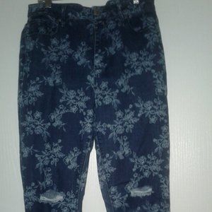 High waisted straight legged distressed jeans a floral pattern denim